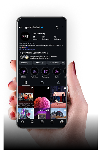 Hand holding a phone showing the Dart Marketing Instagram profile